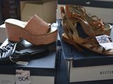 two pairs of shoes that are on display in a store