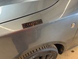 a sticker that says caution on the side of a car