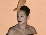 an image of a woman with a shoe on her head