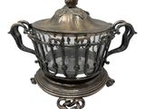 an image of a silver plate with a bird on top of it