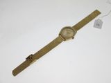 a close up of a watch on a white surface with a price tag