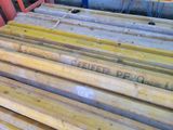 a pile of wooden planks stacked on top of each other