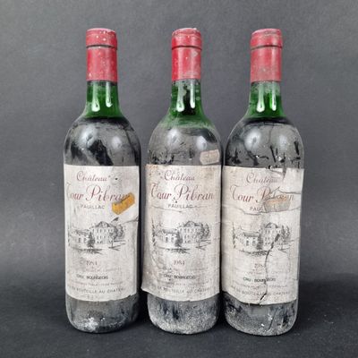 three bottles of wine sitting next to each other on a table