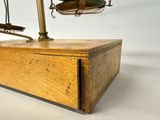 a wooden box with a scale on top of it