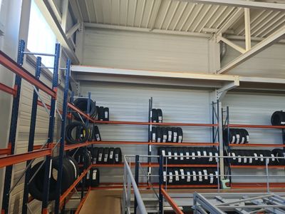 a large room with lots of racks and shelves filled with luggage