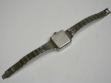 a watch that is sitting on a white surface