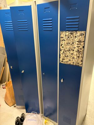 two blue lockers that are next to each other in a room