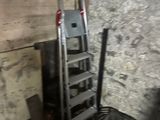 a ladder that is leaning against a wall in a room