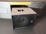a close up of a speaker sitting on top of a table
