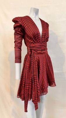 a red and black checkered dress on a mannequin mannequin mannequin mannequin mannequin mannequin mannequin manne