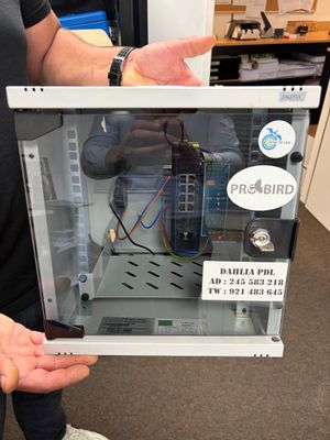 a man that is holding a computer in his hand