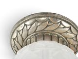 a close up of a light fixture with a glass shade