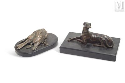 pair of bronze figurines of a dog and a bird on a marble base
