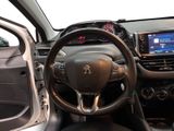 the interior of a car with a steering wheel and dashboard controls