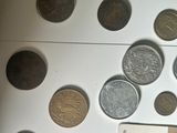 a lot of coins on the table with a book