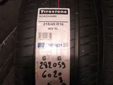 tires on a brick wall with a price tag attached to them
