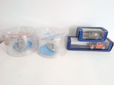 three plastic containers that are sitting on a table