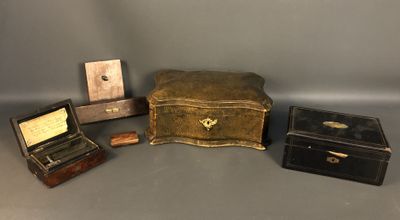 three small wooden boxes and a small wooden box on a gray surface