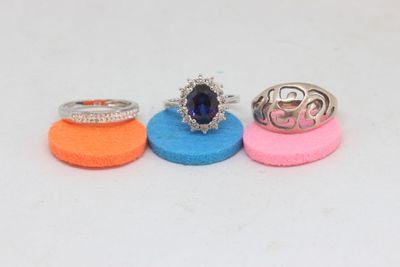 three rings are sitting on top of each other on a white surface