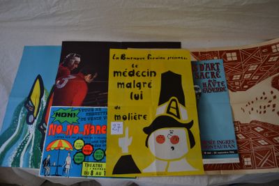 many books that are laying on a bed together