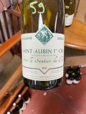 a bottle of wine that is being held by a person
