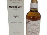 a bottle of mortlach 1990 with box and box