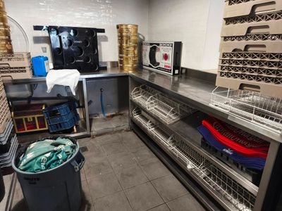 a large kitchen with a lot of dishes in it
