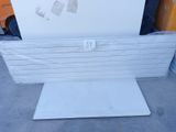a picture of a white refrigerator sitting on top of a pallet