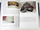 an open book with pictures of items in it