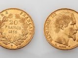 two gold sovereigns, one of which is a head and the other of which is a head