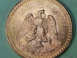 a coin with an eagle on it on a green surface