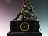 une statue d'un homme assis au sommet d'une horloge