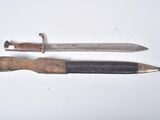 two knives that are laying on a white surface