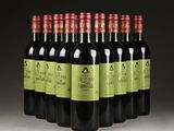 six bottles of red wine are lined up in a row