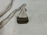a small piece of cloth on the ground next to a piece of cloth
