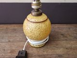 a small lamp that is sitting on a wooden table