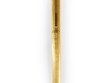 a close up of a gold pen on a white background