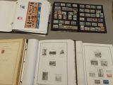 a lot of stamps on a table and a book