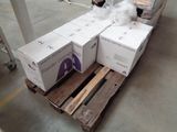 many boxes sitting on a pallet in a warehouse