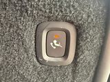 a close up of a button on the seat of a car