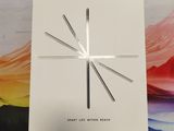 an image of a white clock sitting on top of a table