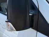 an image of a white van parked in a parking lot