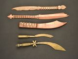 several different types of knives are displayed on a black surface