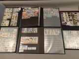 many different types of stamps in a display case
