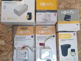three boxes of sony power adapters sitting on top of a wooden floor