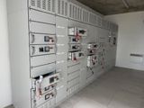 a room with a bunch of electrical equipment on the wall