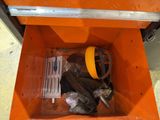 an orange box with tools in it on the floor