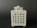 a small white box with chinese writing on it