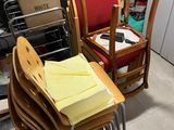 many chairs and tables in a cluttered room