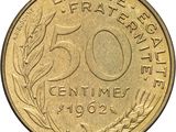 a close up of a 50 cent coin on a white background